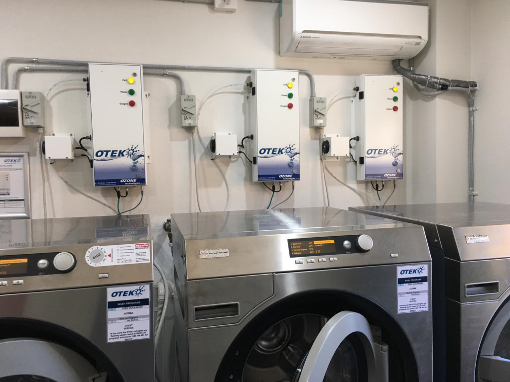Typical installation of an OTEK unit. Mounted on the wall generally behind the washing machine.